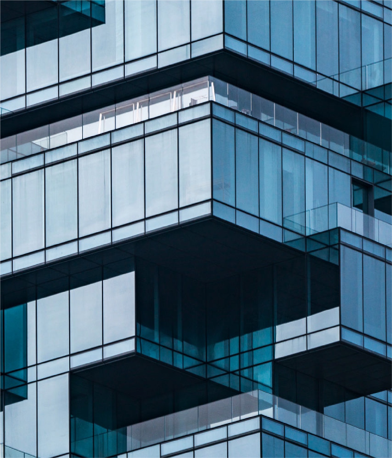 A Skyscraper with an uneven, stacked glass cube appearance.
